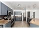 A remodeled kitchen featuring gray cabinets, stainless steel appliances and tiled floors at 8812 N 67Th Dr, Peoria, AZ 85345