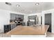 This kitchen features stainless steel appliances, an island, bar seating and dark wood cabinets at 8812 N 67Th Dr, Peoria, AZ 85345
