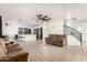Spacious living room with tiled floors, ceiling fan, and an open layout at 8812 N 67Th Dr, Peoria, AZ 85345