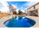 This home boasts a sparkling pool, covered patio, and basketball hoop making it perfect for outdoor entertaining at 8812 N 67Th Dr, Peoria, AZ 85345