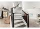 Staircase featuring modern design and carpeted steps at 8812 N 67Th Dr, Peoria, AZ 85345