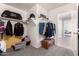 Walk-in closet includes shelving, clothing racks and storage chest creating an organized space at 8812 N 67Th Dr, Peoria, AZ 85345