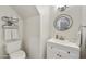 Stylish powder room with modern vanity, decorative mirror, and elegant fixtures at 9065 E Gary Rd # 121, Scottsdale, AZ 85260