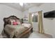 Bedroom with a ceiling fan, plush carpet, and a beautifully decorated bed at 9065 E Gary Rd # 121, Scottsdale, AZ 85260