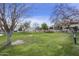 Expansive community green space featuring mature trees, well-maintained lawn, and desert-style architecture at 9065 E Gary Rd # 121, Scottsdale, AZ 85260