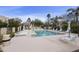 Community pool surrounded by lounge chairs and desert landscaping, offering a serene retreat at 9065 E Gary Rd # 121, Scottsdale, AZ 85260
