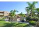Inviting community pool area surrounded by lush landscaping and mature trees on a clear day at 9065 E Gary Rd # 121, Scottsdale, AZ 85260
