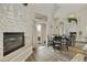 Elegant dining area with a cozy fireplace and an adjacent outdoor patio at 9065 E Gary Rd # 121, Scottsdale, AZ 85260