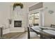 Dining area with a stone fireplace and sliding glass door access to the outdoor patio at 9065 E Gary Rd # 121, Scottsdale, AZ 85260