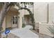 Charming entrance of townhome featuring a decorative archway and well-maintained landscaping at 9065 E Gary Rd # 121, Scottsdale, AZ 85260