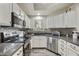 Updated kitchen with stainless steel appliances, granite counters and new floors at 9065 E Gary Rd # 121, Scottsdale, AZ 85260