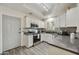 Modern kitchen with stainless steel appliances, stylish backsplash, and ample cabinet space at 9065 E Gary Rd # 121, Scottsdale, AZ 85260
