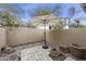 Private backyard patio features a large umbrella, low maintenance landscaping and desert views at 9065 E Gary Rd # 121, Scottsdale, AZ 85260