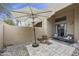 Backyard patio features low maintenance landscaping, an umbrella, comfortable seating and building access at 9065 E Gary Rd # 121, Scottsdale, AZ 85260