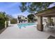 Community pool with ample lounge seating and mature landscaping offers a resort-like experience at 9065 E Gary Rd # 121, Scottsdale, AZ 85260