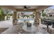 Covered poolside patio offering shaded seating with ceiling fan, overlooking the community pool area at 9065 E Gary Rd # 121, Scottsdale, AZ 85260