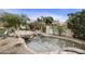Beautiful community water feature with natural rock accents, lush landscaping, and peaceful setting at 9065 E Gary Rd # 121, Scottsdale, AZ 85260
