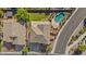 Overhead view of a home with pool, desert landscaping, and tiled roof in a suburban neighborhood at 9237 W Alex Ave, Peoria, AZ 85382