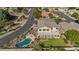 Aerial view of backyard with pool, patio, and lush landscaping in a residential neighborhood at 9237 W Alex Ave, Peoria, AZ 85382