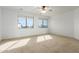 Bright bedroom with two windows and neutral carpet at 9237 W Alex Ave, Peoria, AZ 85382