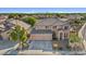Beautiful two-story home with three-car garage and desert landscaping at 9237 W Alex Ave, Peoria, AZ 85382
