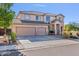 Charming two-story home with a spacious driveway and desert-style landscaping at 9237 W Alex Ave, Peoria, AZ 85382