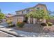 Charming two-story home with a three-car garage and mature landscaping at 9237 W Alex Ave, Peoria, AZ 85382