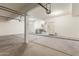 Unfinished garage with ample space at 9237 W Alex Ave, Peoria, AZ 85382