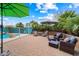 Beautiful backyard with a lounge area, a swimming pool, and desert landscaping at 9263 E Monterey Ave, Mesa, AZ 85209