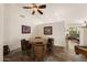 Dining area with rustic barrel chairs, wooden table, and neutral decor, perfect for entertaining guests at 9263 E Monterey Ave, Mesa, AZ 85209