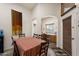 Cozy dining area featuring a table for six, a breakfast bar, and elegant interior detailing at 9263 E Monterey Ave, Mesa, AZ 85209