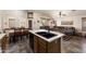 Spacious kitchen with breakfast bar flowing into the living area, complete with modern appliances and stylish finishes at 9263 E Monterey Ave, Mesa, AZ 85209