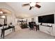 Open-concept living room leads to kitchen and dining area with recessed lighting at 9658 E Olla Ave, Mesa, AZ 85212