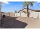 Large backyard with privacy walls, desert landscaping, and potential for outdoor activities at 9718 E Boston St, Mesa, AZ 85207