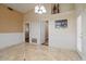 Spacious living room with marble flooring, decorative wainscoting, and recessed lighting at 9718 E Boston St, Mesa, AZ 85207