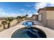 Charming backyard featuring a pool and spa, enhanced by mature landscaping and an inviting outdoor space at 9734 S 182Nd Dr, Goodyear, AZ 85338