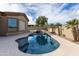 Relaxing backyard oasis featuring a refreshing pool, mature landscaping, and ample space for outdoor entertaining at 9734 S 182Nd Dr, Goodyear, AZ 85338