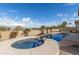Private backyard with a sparkling pool and spa, complemented by lush landscaping and plenty of room to enjoy the outdoors at 9734 S 182Nd Dr, Goodyear, AZ 85338