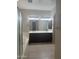 Luxurious bathroom features a double vanity, soaking tub, and walk in closet access at 9734 S 182Nd Dr, Goodyear, AZ 85338