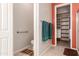 Bright bathroom features a toilet, towel racks and an open door to a walk in closet at 9734 S 182Nd Dr, Goodyear, AZ 85338