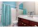 Bathroom featuring a vanity with stylish fixtures, a shower with a curtain and a large mirror at 9734 S 182Nd Dr, Goodyear, AZ 85338