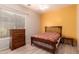 Bedroom with a comfortable bed, ceiling fan, window with blinds, and dresser at 9734 S 182Nd Dr, Goodyear, AZ 85338