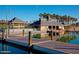 View of the community clubhouse with a dock in the foreground at 9734 S 182Nd Dr, Goodyear, AZ 85338