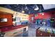 Vibrant game room featuring a pool table, foosball, and classic arcade games at 9734 S 182Nd Dr, Goodyear, AZ 85338