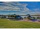 Scenic lake view of the Estrella Yacht Club and surrounding landscape under a blue sky at 9734 S 182Nd Dr, Goodyear, AZ 85338