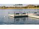 Lake view featuring a dock and a pelican swimming in the water at 9734 S 182Nd Dr, Goodyear, AZ 85338