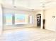 Spacious living room with tile floors, large windows with pool views, and neutral paint at 9734 S 182Nd Dr, Goodyear, AZ 85338