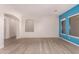 Spacious open-concept living room featuring wood-look floors and easy access to other living spaces at 9734 S 182Nd Dr, Goodyear, AZ 85338
