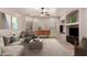 Living room with modern furnishings, neutral decor, and large windows for natural light at 9734 S 182Nd Dr, Goodyear, AZ 85338