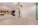 Bright living room featuring an open concept and easy access to the kitchen at 9734 S 182Nd Dr, Goodyear, AZ 85338